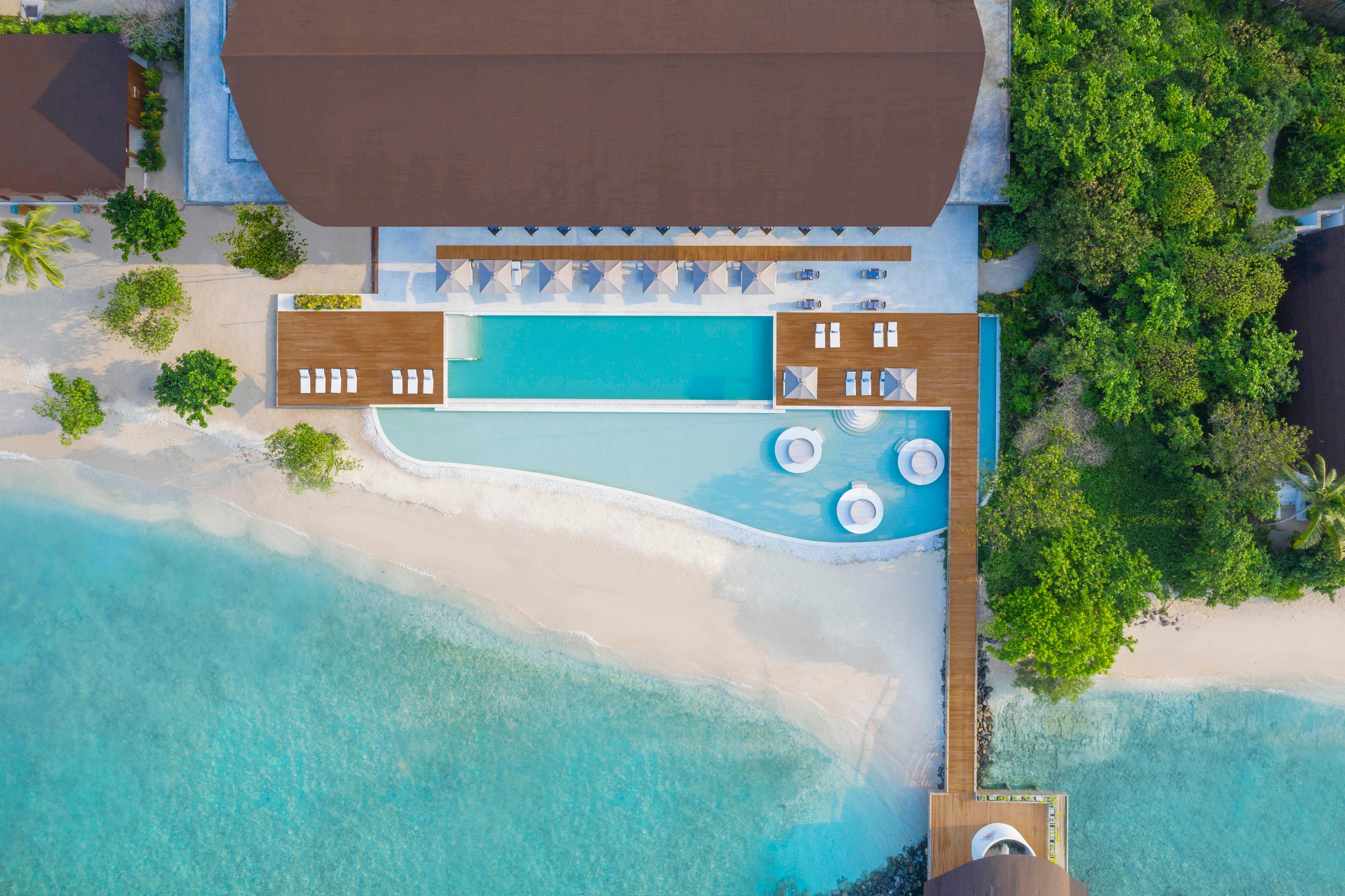 The Westin Maldives Miriandhoo Resort - Hero Aerial Pool.jpg