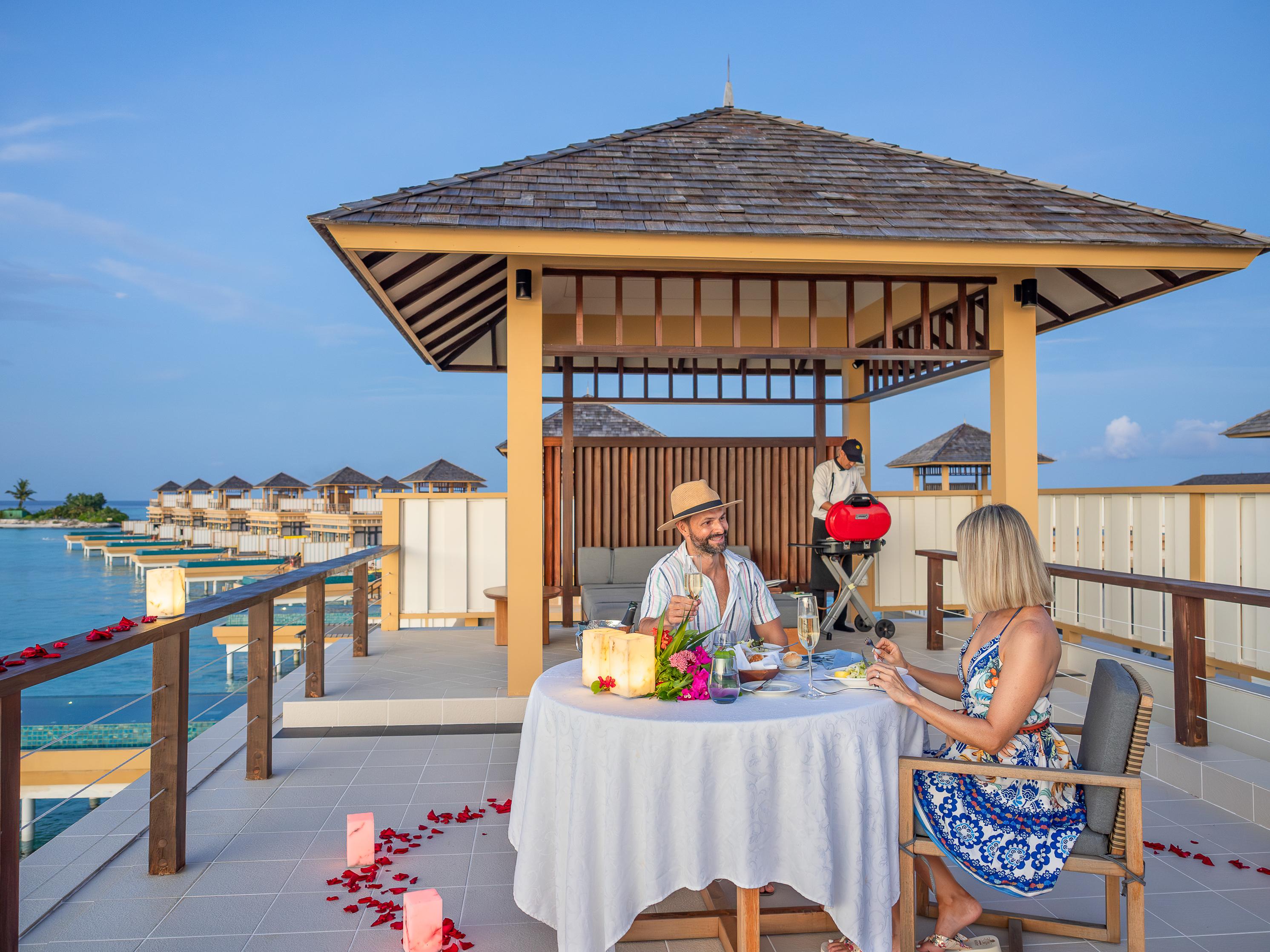 Angsana Velavaru_Rooftop BBQ_Lifestyle Couple.jpg