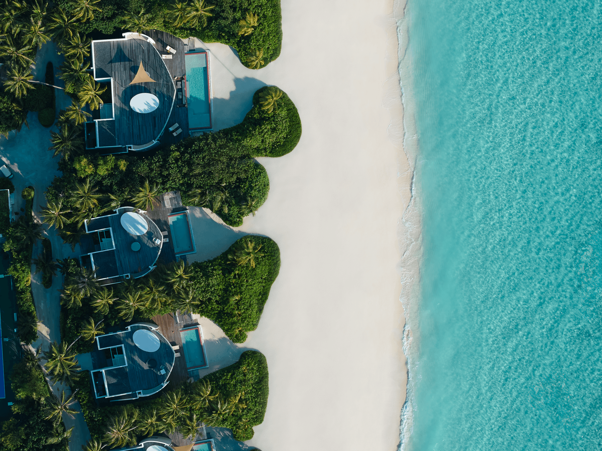 Jumeirah Olhahali Island_Aerial_Beach Villas.png