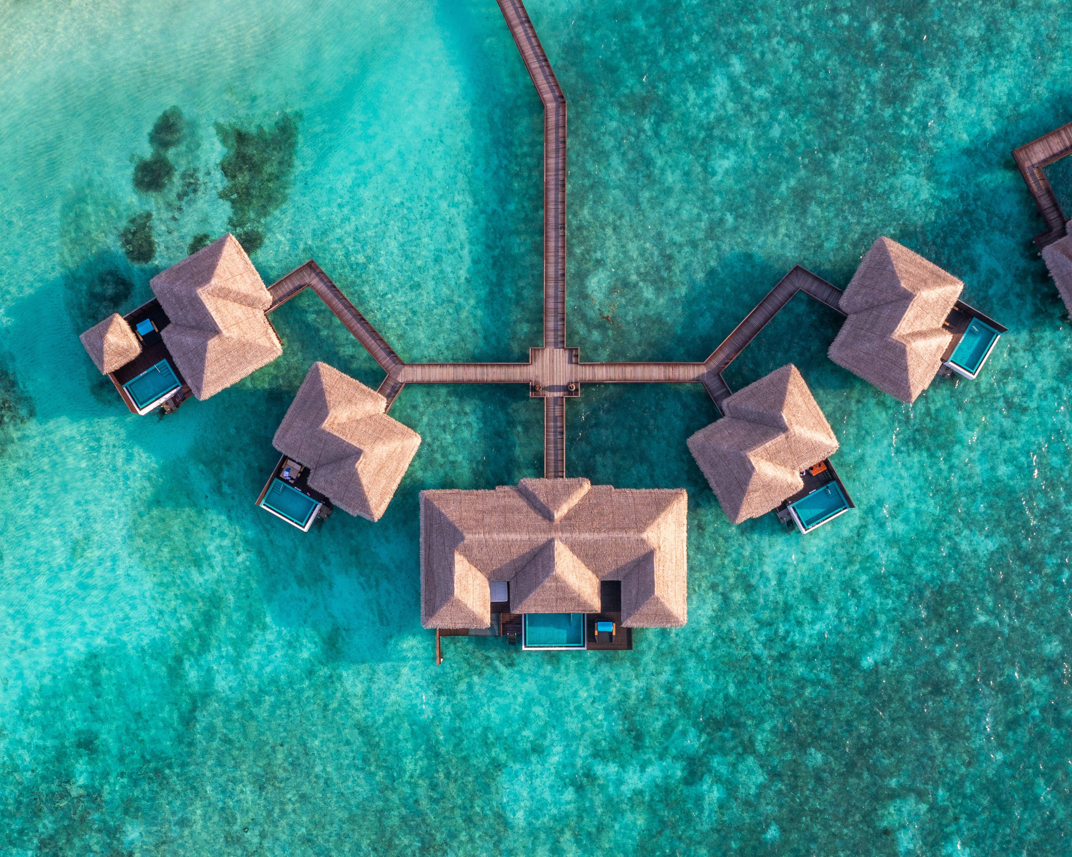Sheraton Maldives Full Moon Resort & Spa - Overwater Villa Aerial.jpg