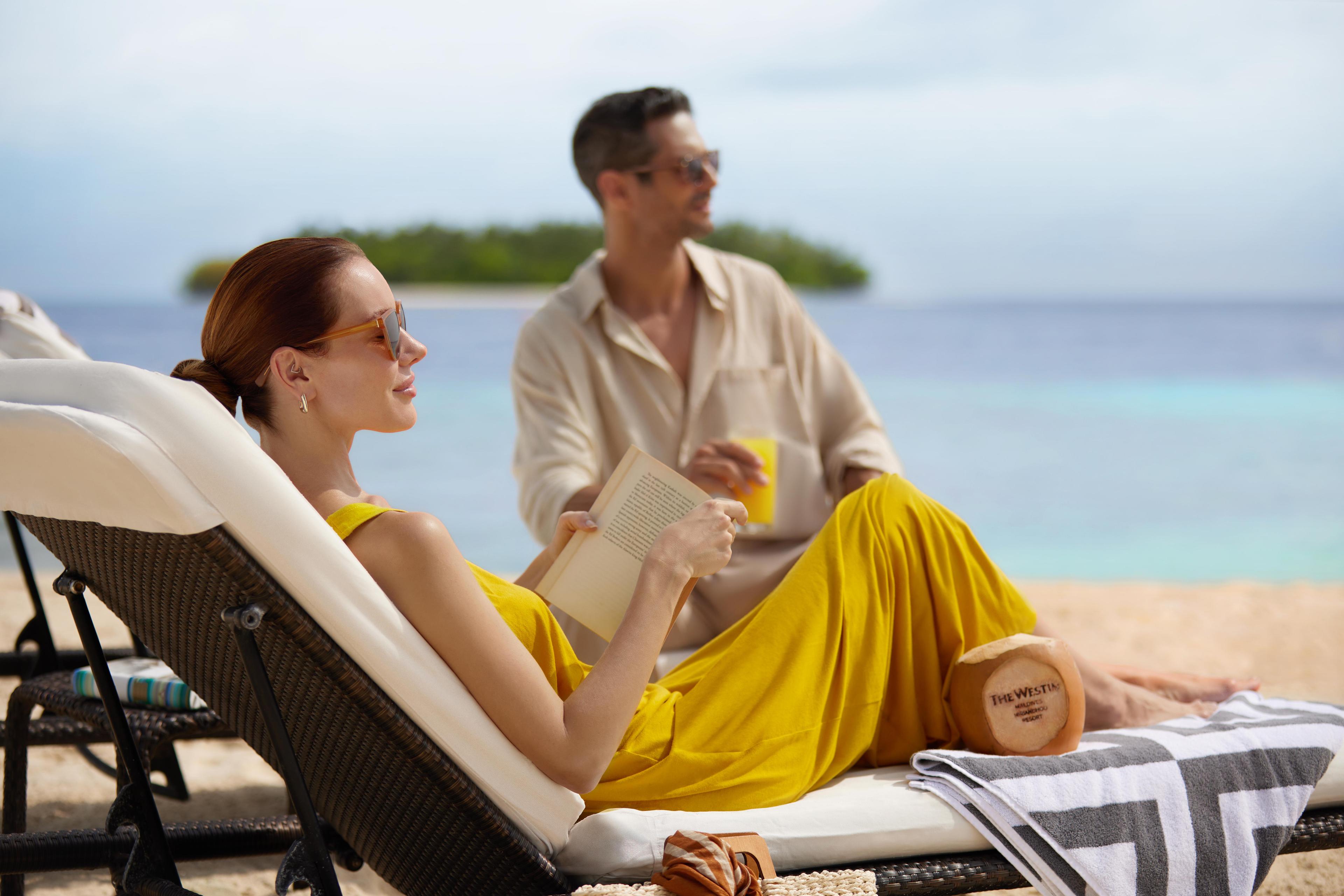 The Westin Maldives Miriandhoo Resort - Couple by the Beach.jpg