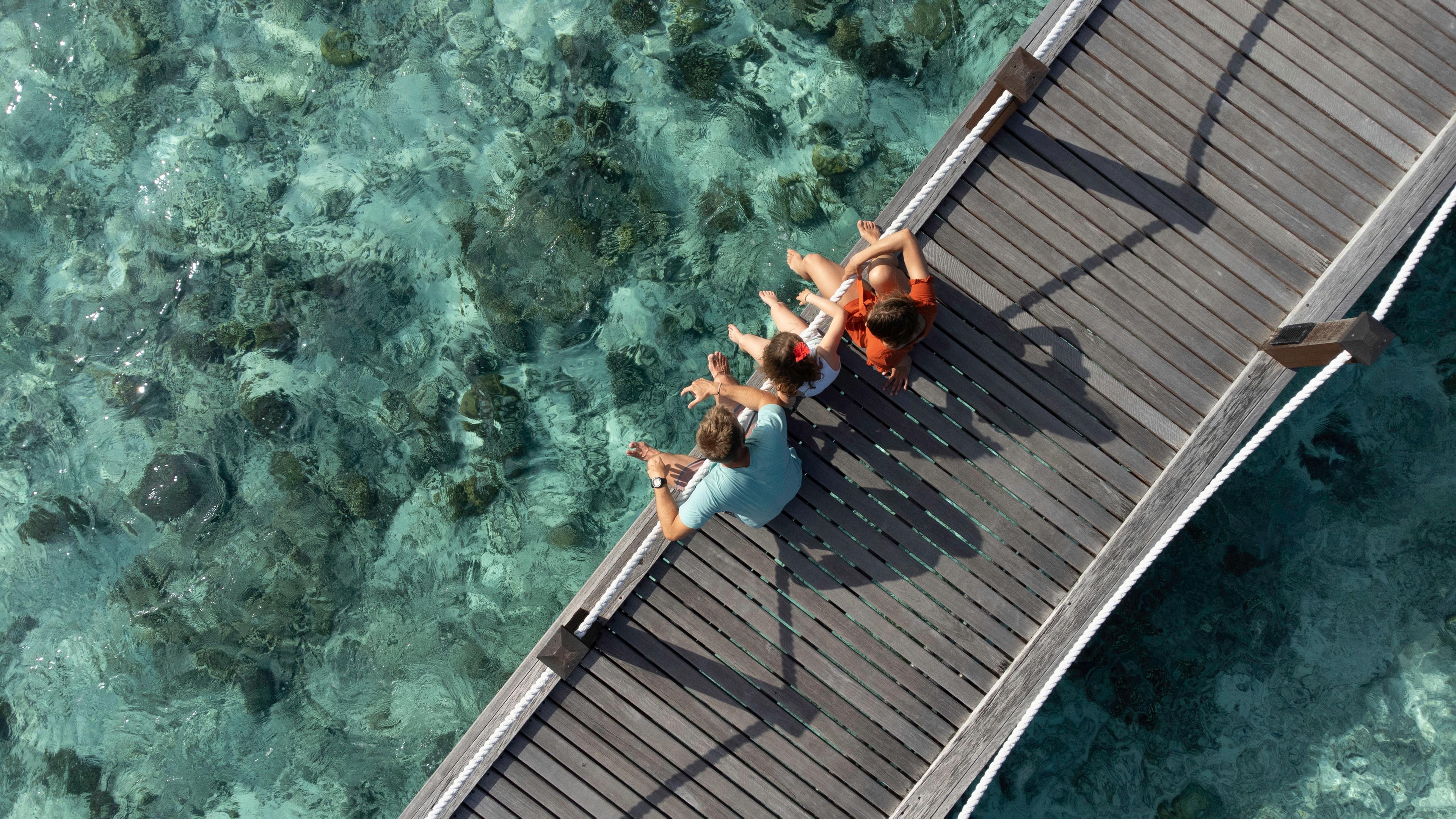 Sheraton Maldives Full Moon Resort & Spa - Family on Bridge.jpg