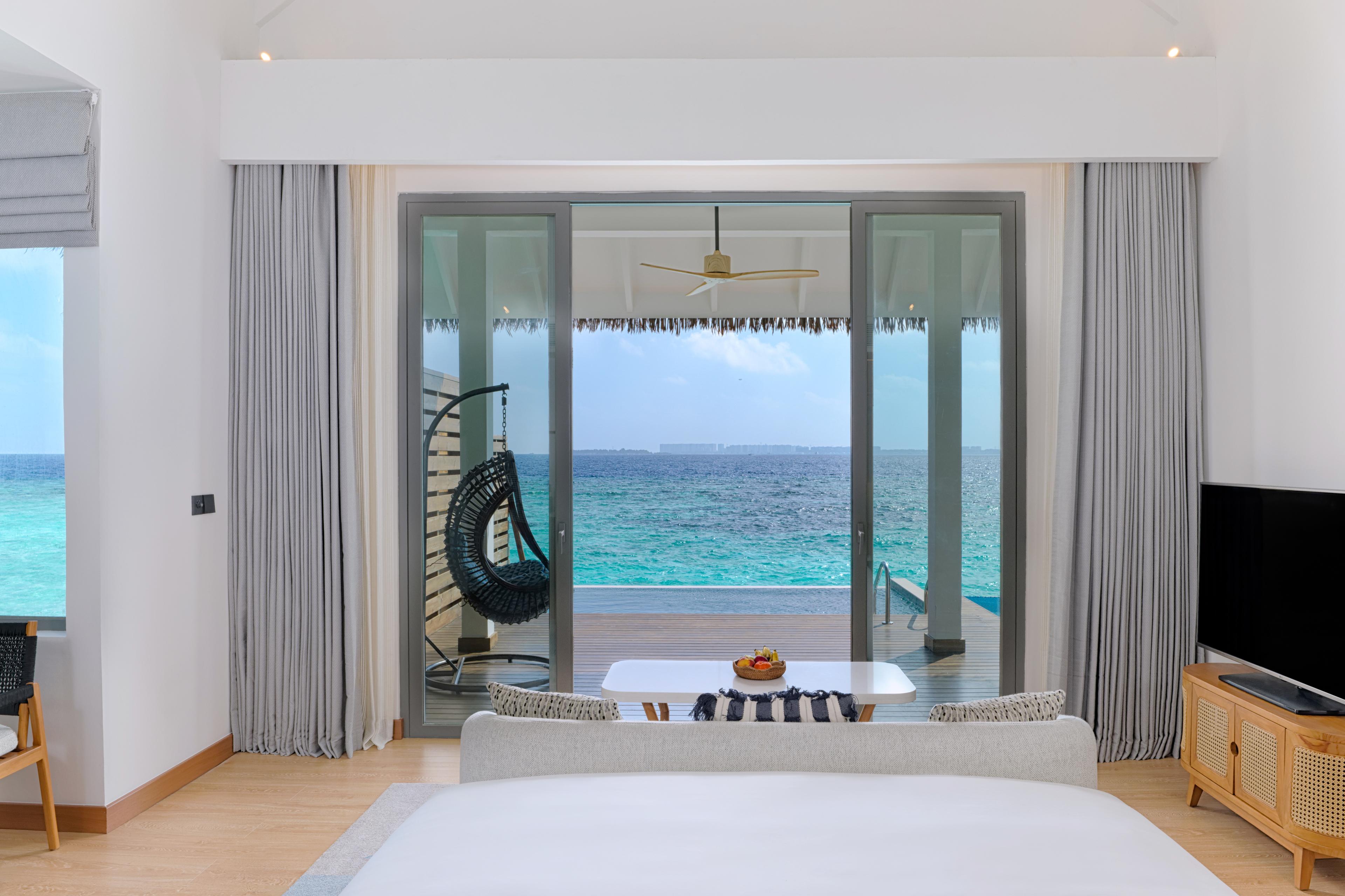 dusitd2-feydhoo-maldives-accommodation-overwater-pool-villa-bedroom-view.jpg