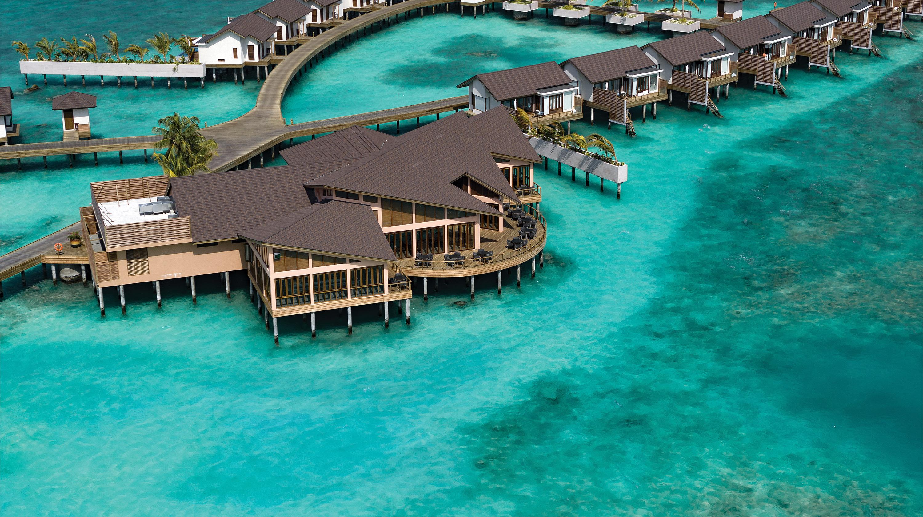 ATMOSPHERE KANIFUSHI MALDIVES - AERIALS AND GENERIC - Water Villa Jetty Aerial with PIER SIX - 02_2020.jpg