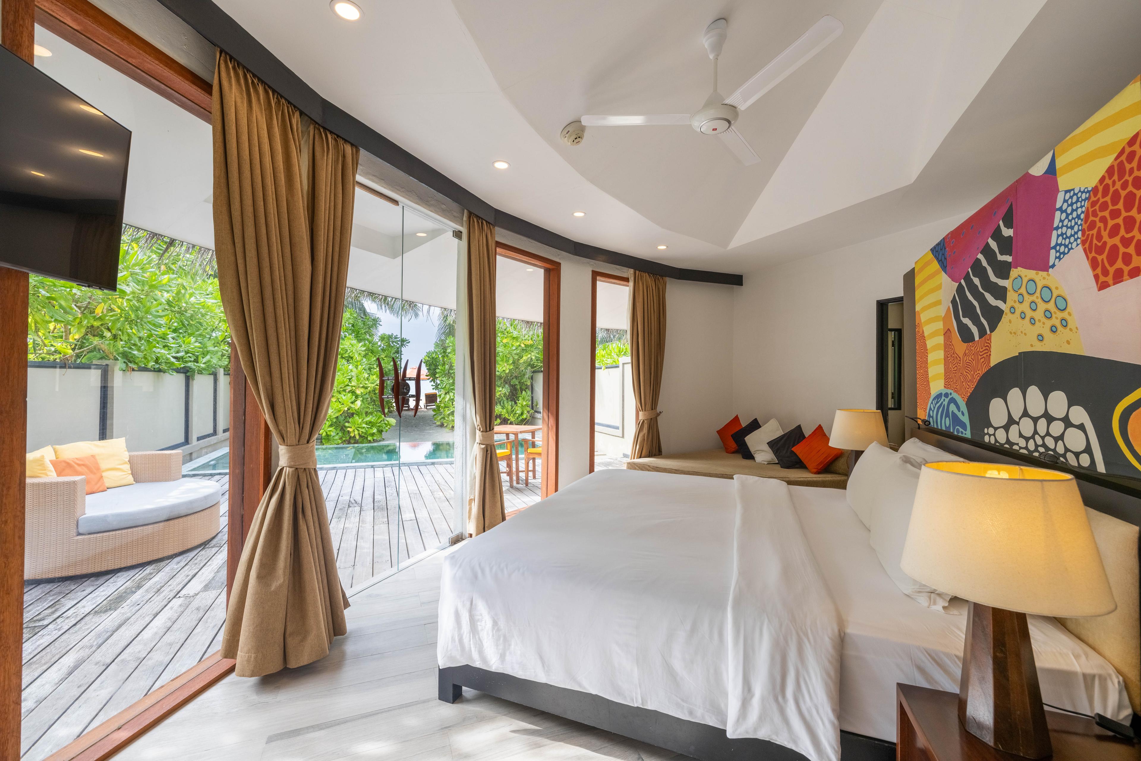 Angsana Velavaru_Beachfront Family Pool Villa_Interior_King Bed_1.jpg