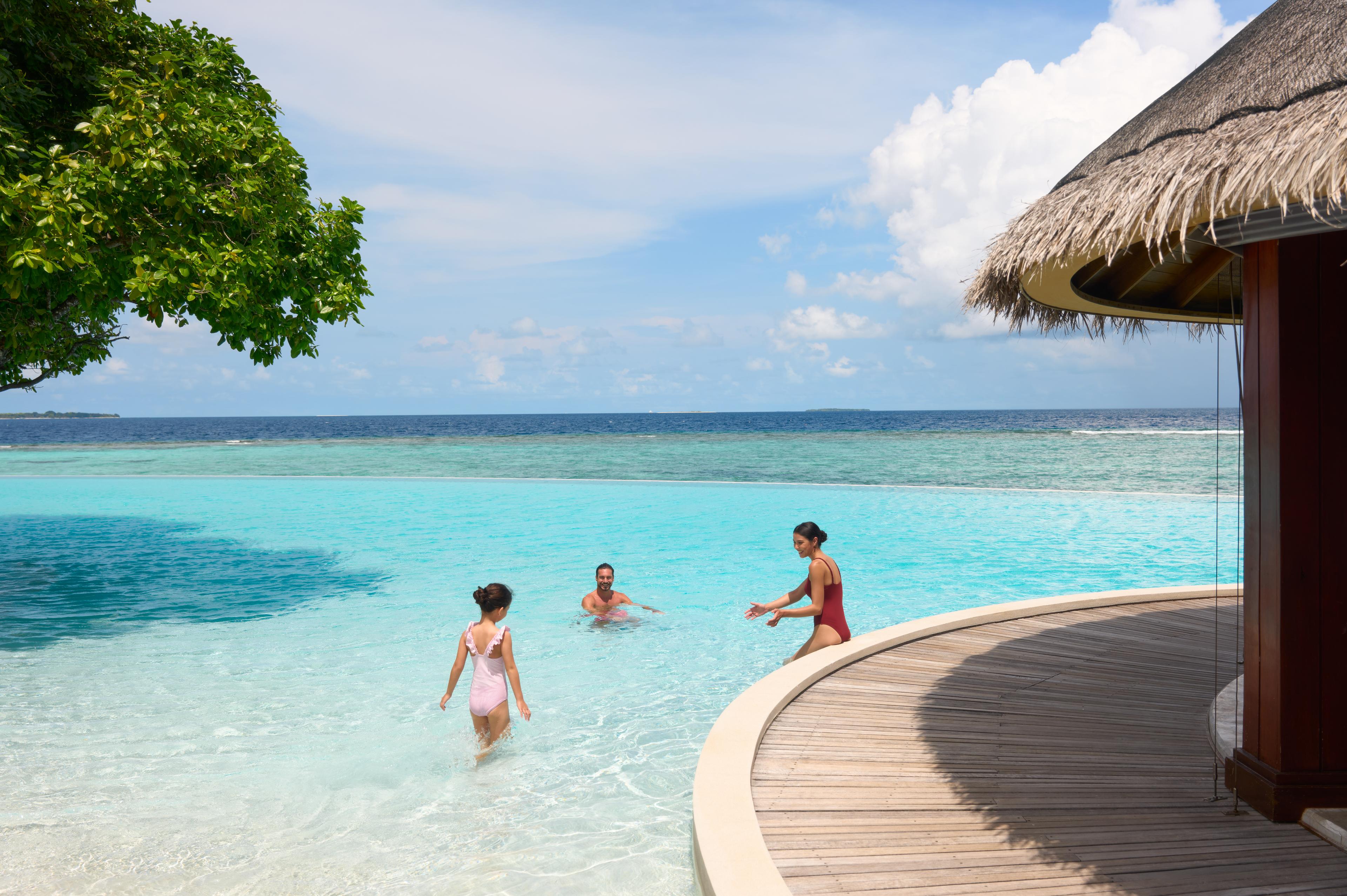 dusit-thani-maldives-facility-pool-lifestyle-family.jpg